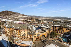 Snowy aerial view with a mountain view
