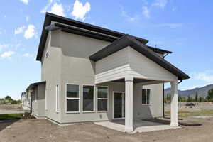 Rear View of Home with Cvd Patio