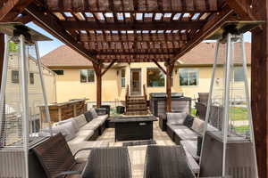 View of patio featuring outdoor lounge area and a pergola