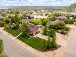 Aerial view of residential area featuring a mountainous background