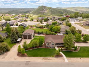 Aerial perspective of suburban area featuring a mountain backdrop