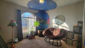 Living area featuring carpet flooring