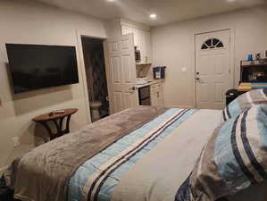 Bedroom with ensuite bathroom and recessed lighting