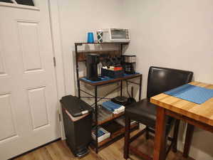 Home office with light wood-type flooring
