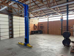 Garage featuring metal wall