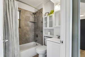 Bathroom featuring shower / tub combo and vanity