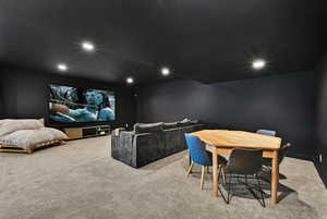 Carpeted cinema with recessed lighting