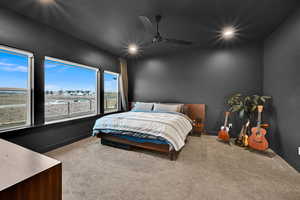 Primary Bedroom with carpet flooring, ceiling fan, and recessed lighting