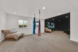 living room with light colored carpet and recessed lighting