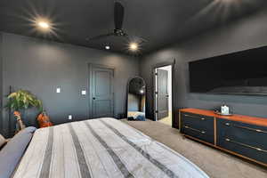 Primary Bedroom with carpet and a ceiling fan