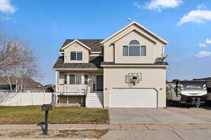 Traditional home featuring driveway, covered porch, roof with shingles, an attached garage, and stairs