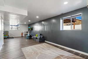 Sitting room with recessed lighting and wood finished floors