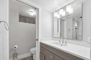 Full bath with vanity and toilet