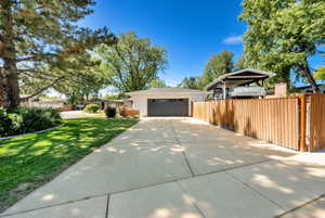 View of front of home with driveway and stucco siding