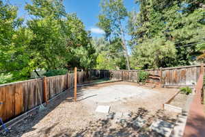 View of fenced backyard