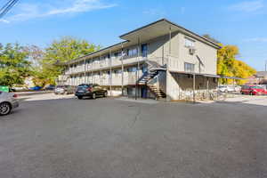 View of apartment building / complex featuring stairway