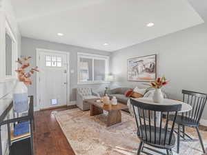 Living room featuring wood-type flooring and recessed lighting