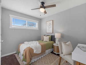Bedroom featuring a ceiling fan and wood finished floors