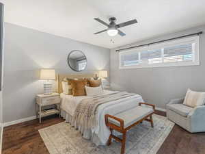 Bedroom featuring ceiling fan and dark wood finished floors