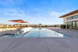 Community pool featuring a patio area