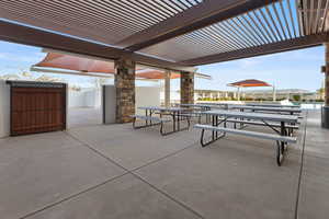View of patio with a pergola and outdoor dining space