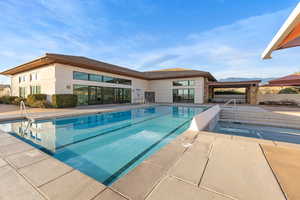 Community pool with a patio