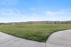 View of yard with an area for sports and a mountain view