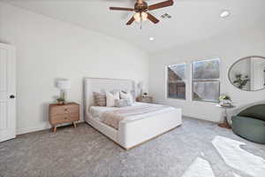 Bedroom featuring vaulted ceiling, carpet, a ceiling fan, and recessed lighting