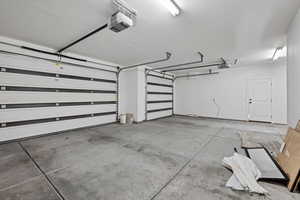 Garage featuring a garage door opener