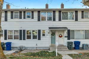 View of front of house featuring a chimney