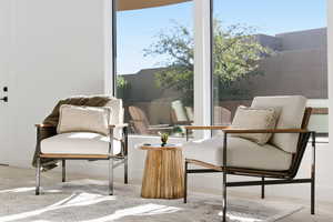 Sitting room featuring carpet flooring