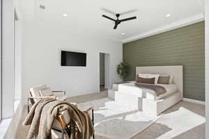 Bedroom featuring recessed lighting, light colored carpet, a ceiling fan, and wooden walls