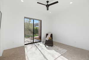 Unfurnished room with light carpet, a ceiling fan, and recessed lighting
