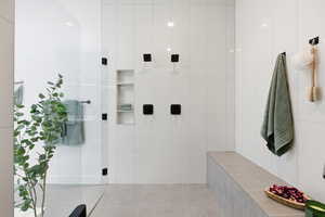 Full bathroom featuring a stall shower and tile patterned floors