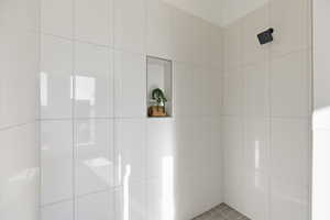 Bathroom with tiled shower