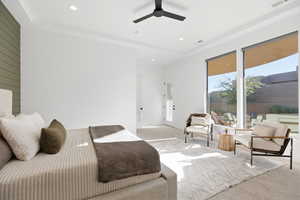 Carpeted bedroom with ceiling fan and recessed lighting