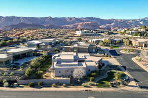 Aerial perspective of suburban area featuring a mountain backdrop