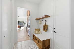 Mudroom with light wood-type flooring and recessed lighting