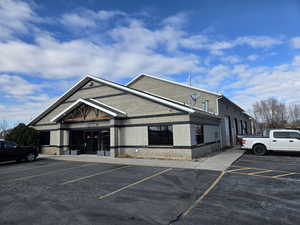 View of commercial location with uncovered parking