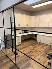 Unfurnished office featuring dark wood-style flooring