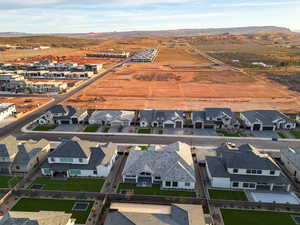 Aerial perspective of suburban area with a mountainous background