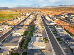 Aerial view of property and surrounding area with nearby suburban area