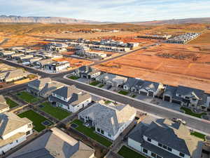 Aerial perspective of suburban area with a mountain backdrop