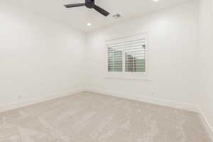 Spare room with recessed lighting, light carpet, and ceiling fan