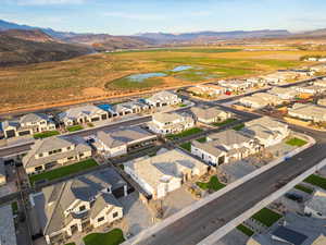 Aerial perspective of suburban area with a water and mountain view