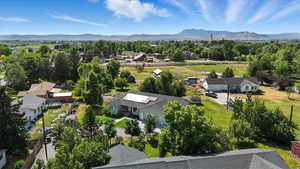 Aerial view of residential area featuring a mountainous background
