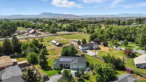 Aerial view of residential area featuring a mountainous background