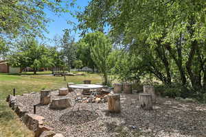 View of green lawn with a patio
