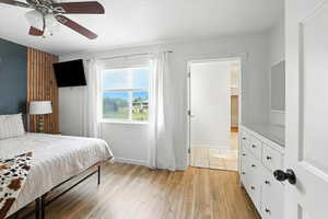 Bedroom with light wood-style flooring and ceiling fan