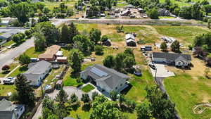 Aerial overview of property's location featuring nearby suburban area